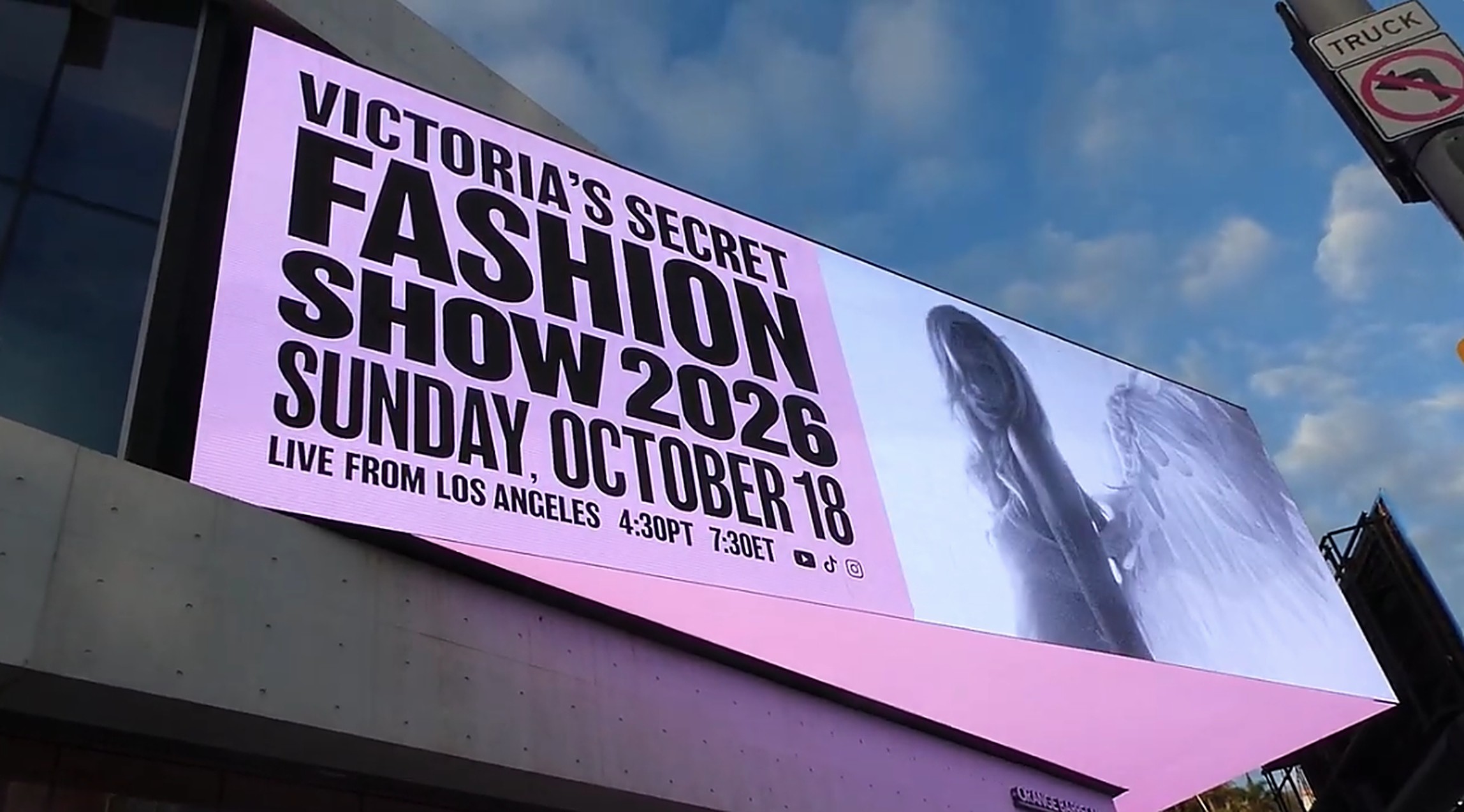 Digital billboard reading Victoria's Secret Fashion Show 2026, Sunday October 18, Live from Los Angeles
